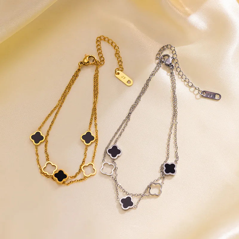 PULSERA DOBLE DE TREBOL NEGRO VAN CLEEF DORADO