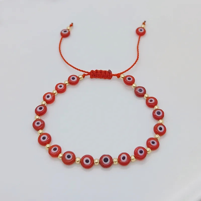 PULSERA OJO TURCO ROJO HILERA CON BALINES DORADO