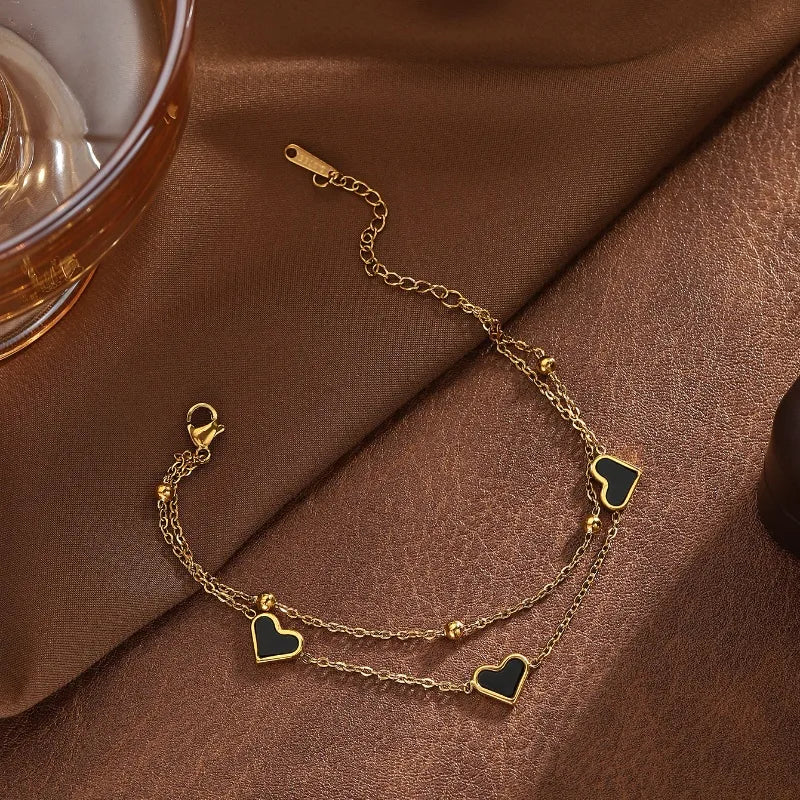 PULSERA DOBLE CON CORAZON NEGRO DORADO
