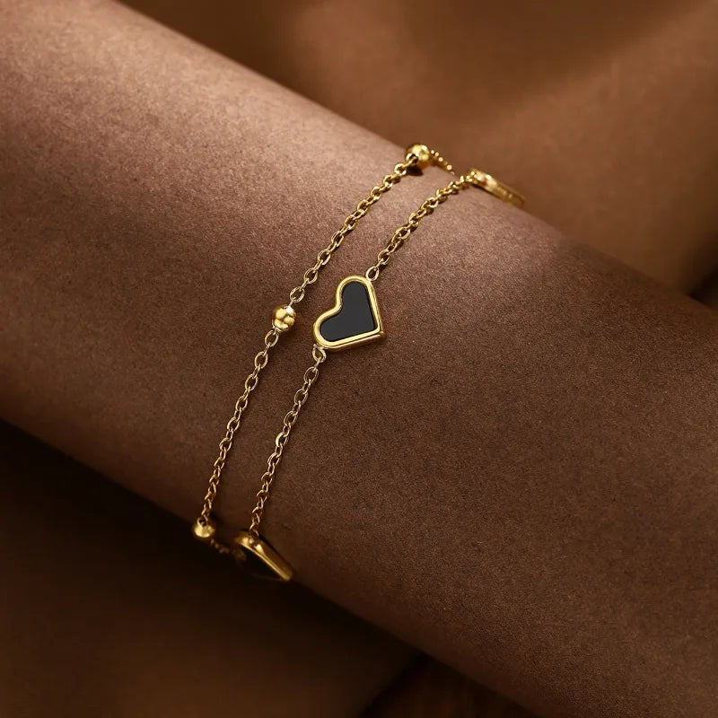 PULSERA DOBLE CON CORAZON NEGRO DORADO