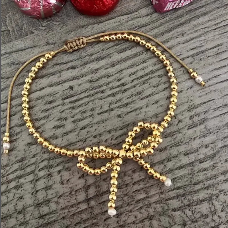 PULSERA LAZO DORADA