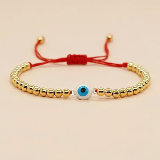 PULSERA OJO TUROCO DORADA