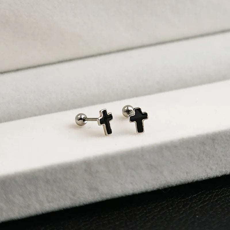 Aretes ortopedicos cruz plateado