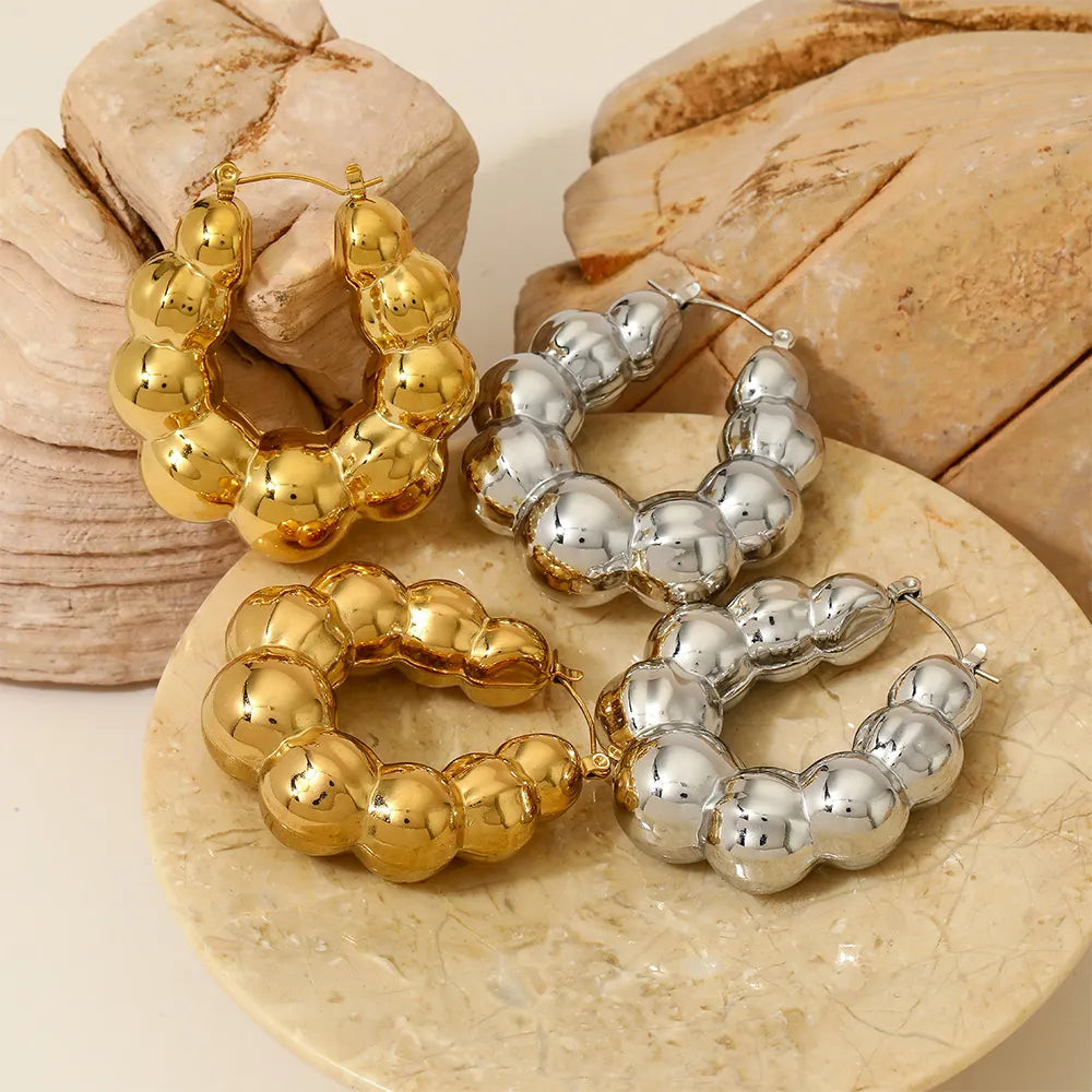 Aretes balines anchos plateado