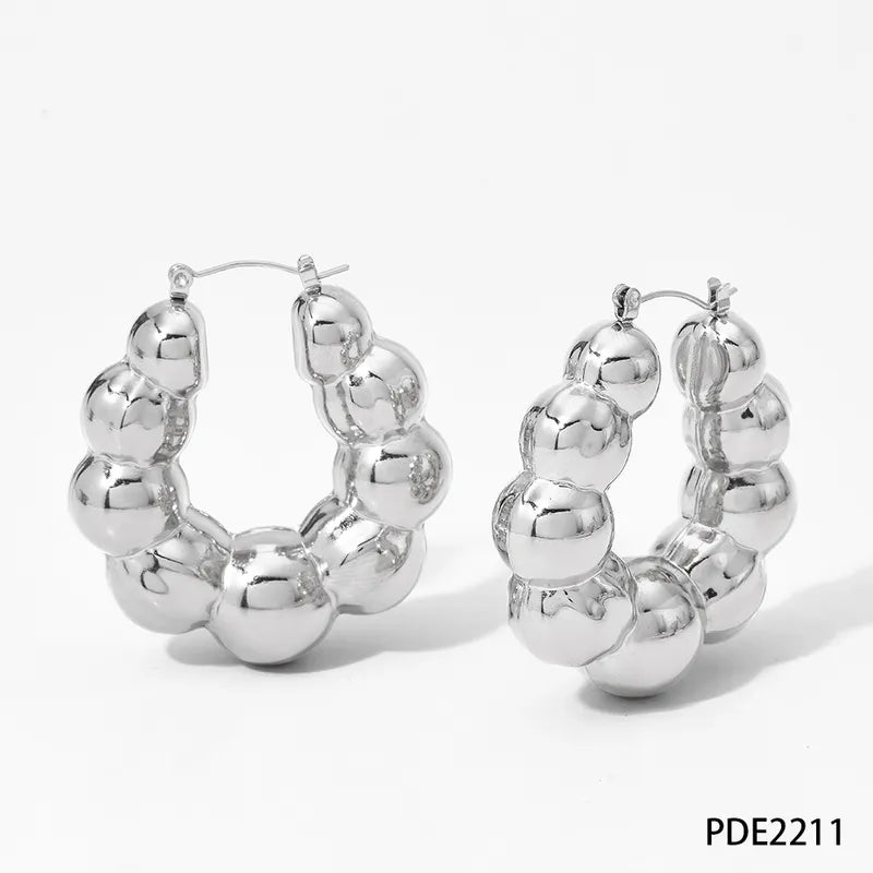 Aretes balines anchos plateado