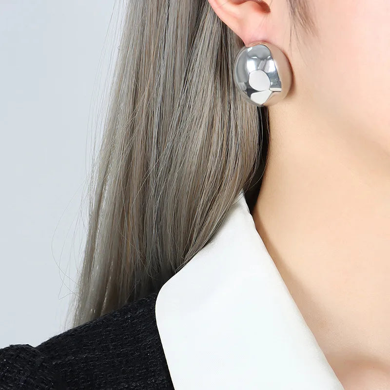 ARETES MEDIA LUNA GRANDES PLATEADO