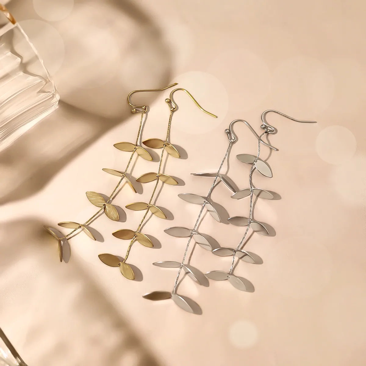 ARETES DE HILERA HOJAS PLATEADO