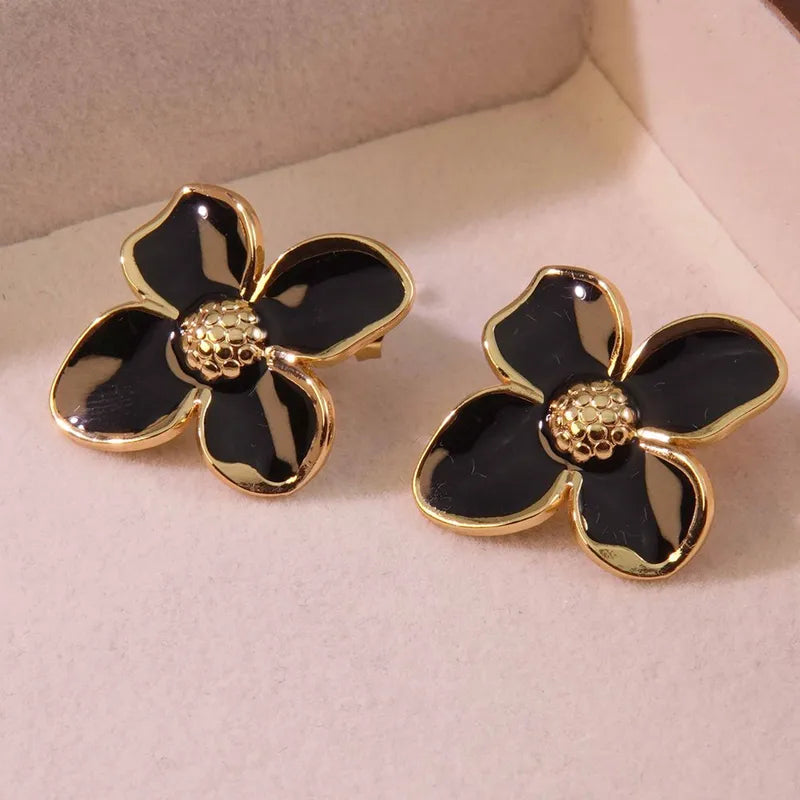 ARETES DE FLOR NEGRO-DORADO