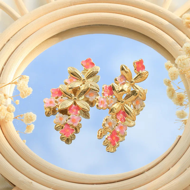 ARETES DE FLORES ROSAS CON DORADO
