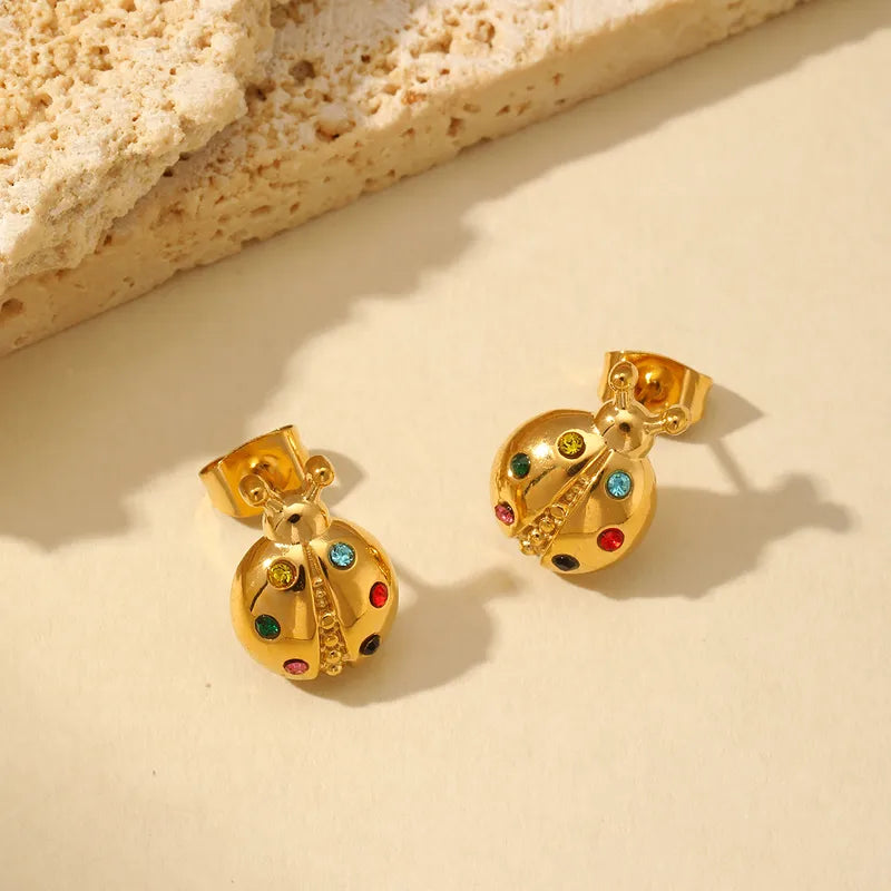 ARETES DE MARIQUITA CON ZIRCONES DORADO