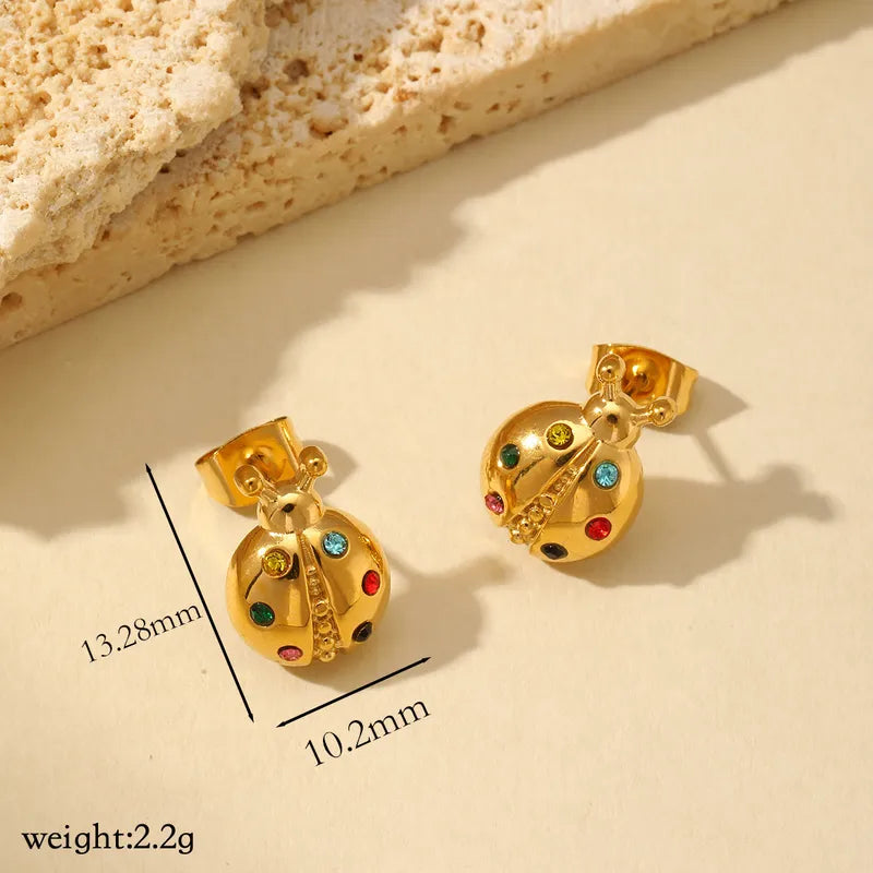 ARETES DE MARIQUITA CON ZIRCONES DORADO