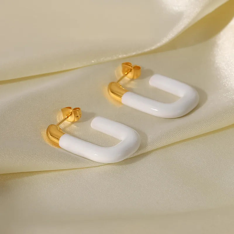 ARETES OVALADOS BLANCOS