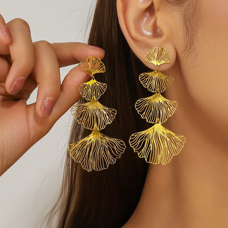 ARETES DE HILERA DE FLOR DORADO