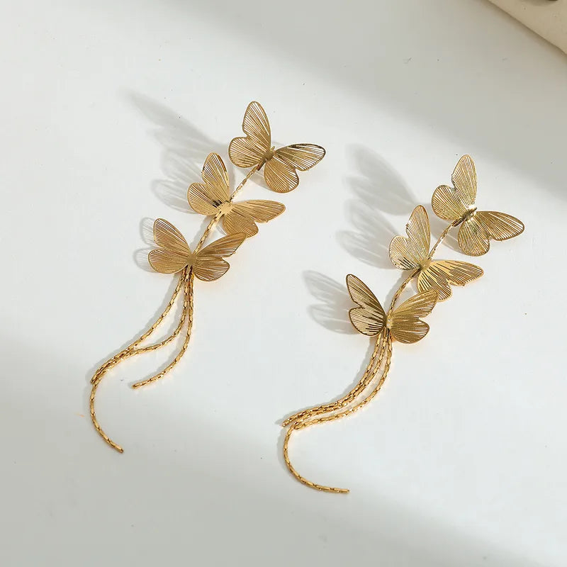 ARETES HILERA DE MARIPOSA DORADO