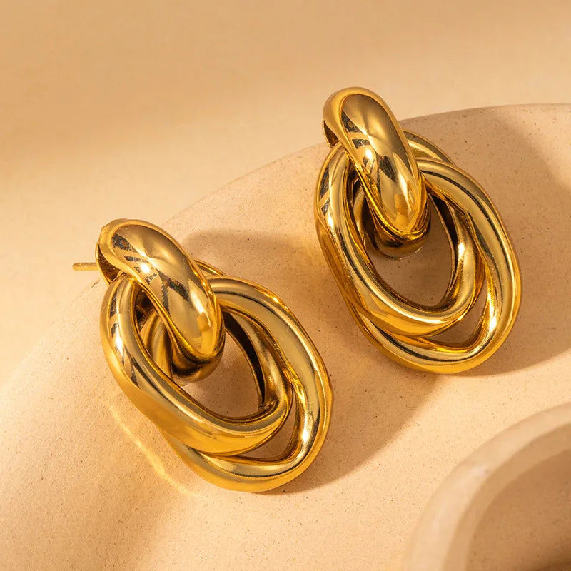 ARETES DOBLE NUDO DORADO