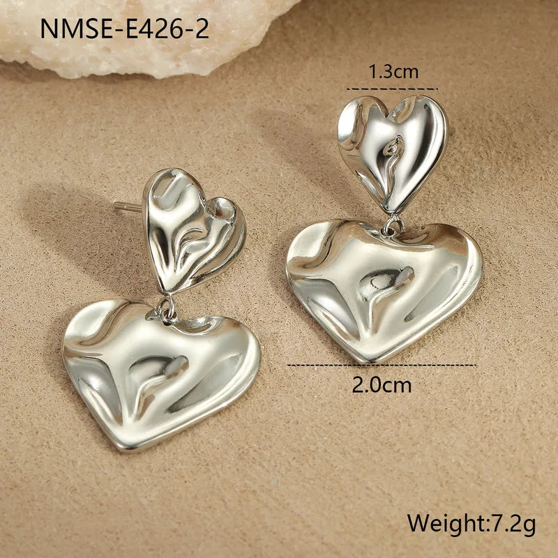 ARETES DOBLE CORAZON IRREGULAR PLATEADO