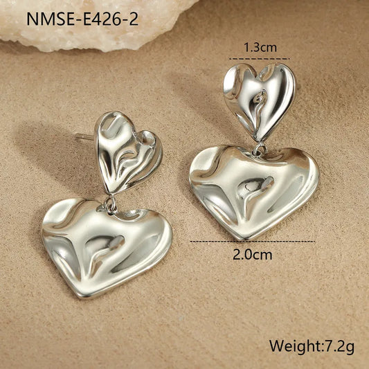 ARETES DOBLE CORAZON IRREGULAR PLATEADO