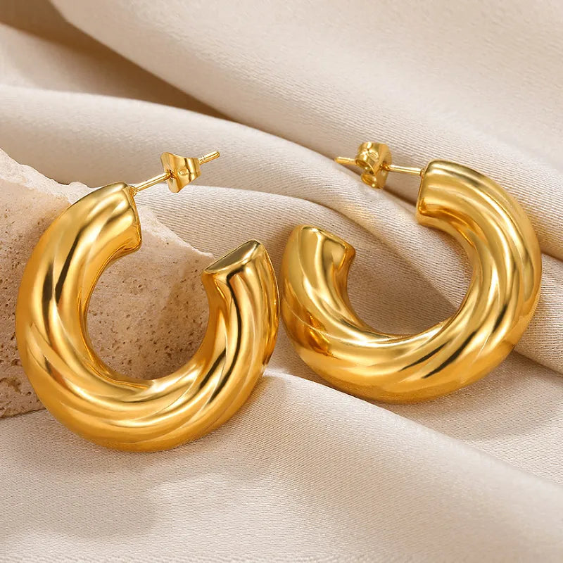 ARETES ARGOLLAS RELIEVE ESPIRAL DORADO