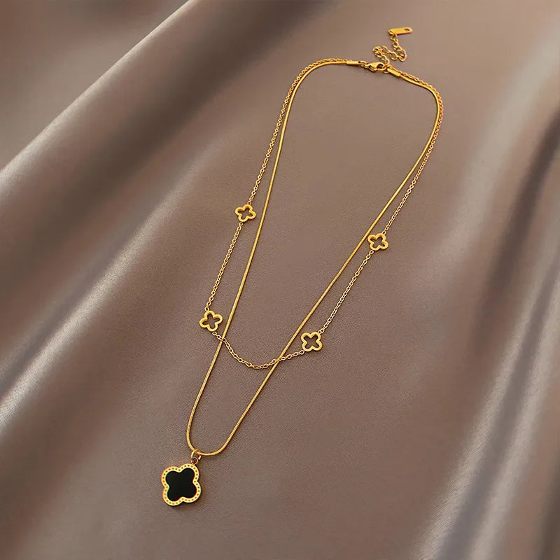 LAYER DOBLE DE TREBOL NEGRO CON DORADO
