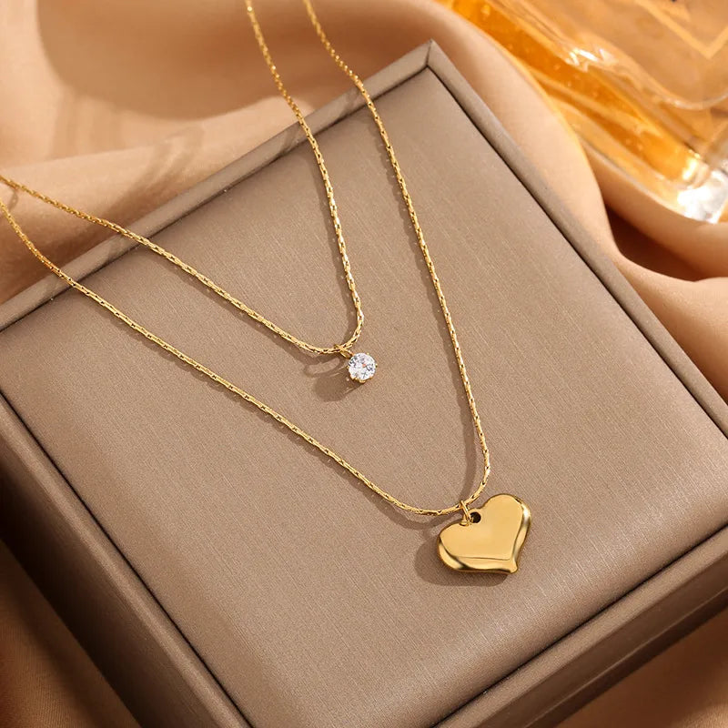 LAYER DOBLE DE CORAZON CON ZIRCON DORADO