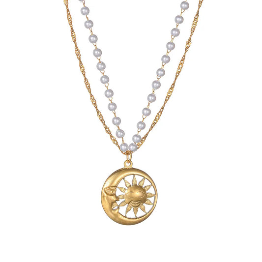 LAYER CON PERLAS Y DIJE DE SOL Y LUNA