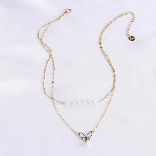 LAYER DOBLE CON PERLAS Y DIJE DE MARIPOSA