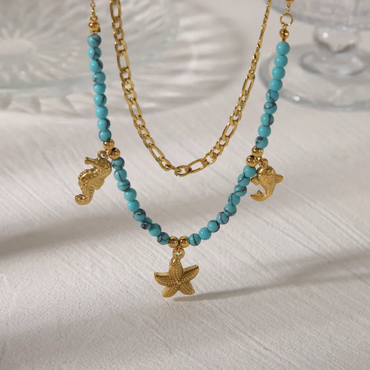 LAYER DOBLE CON PIEDRAS CELESTES Y DIJES DE MAR