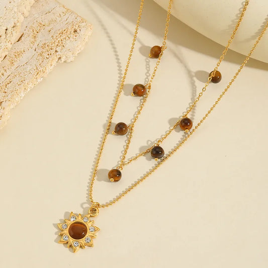 LAYER DOBLE CON PIEDRAS Y DIJE DE GIRASOL
