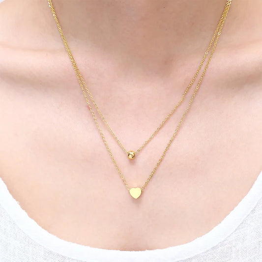 LAYER DOBLE CON DIJE DE CORAZON Y PERLA DORADA