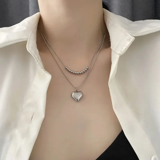 LAYER DOBLE CON PERLAS PLATEADAS Y CORAZON