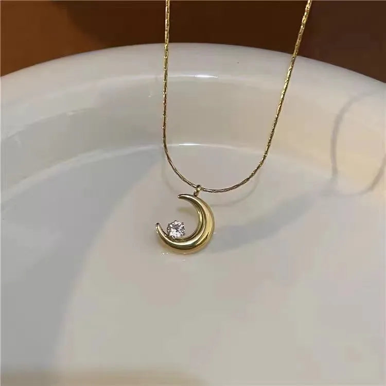 CADENA DE LUNA CON ZIRCON DORADO