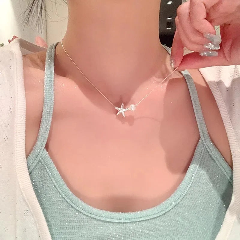 CADENA DE ESTRELLA CON PERLA PLATEADO