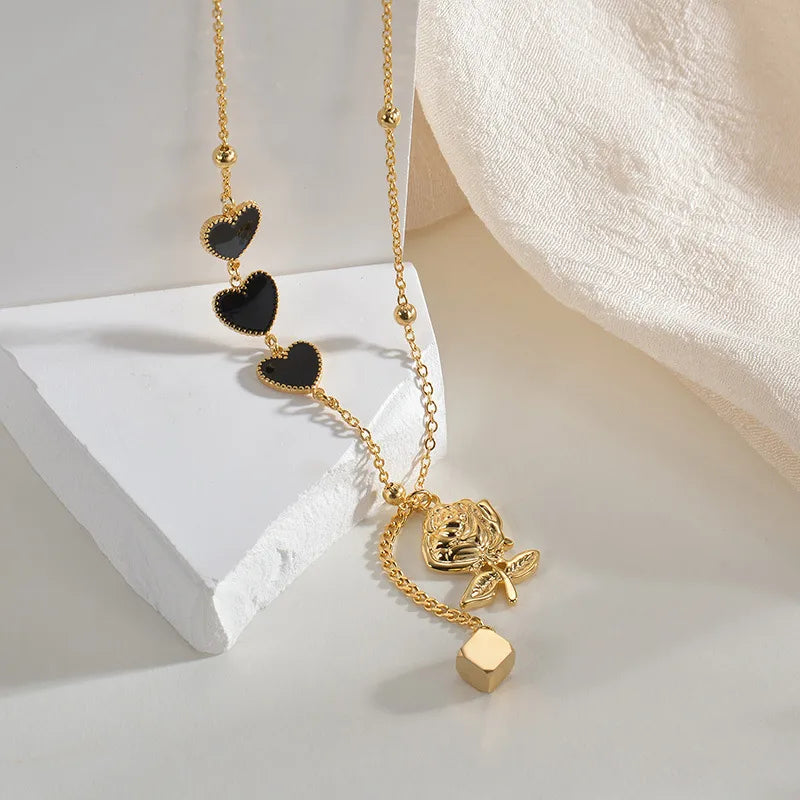 CADENA ROSA CON CORAZONES NEGRO-DORADO