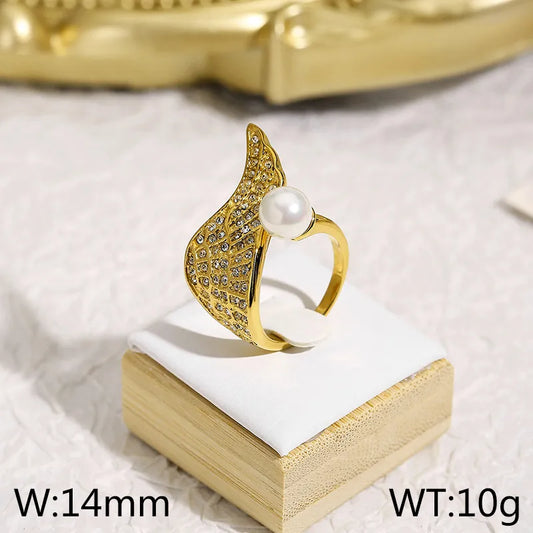 Anillo zircones con perla