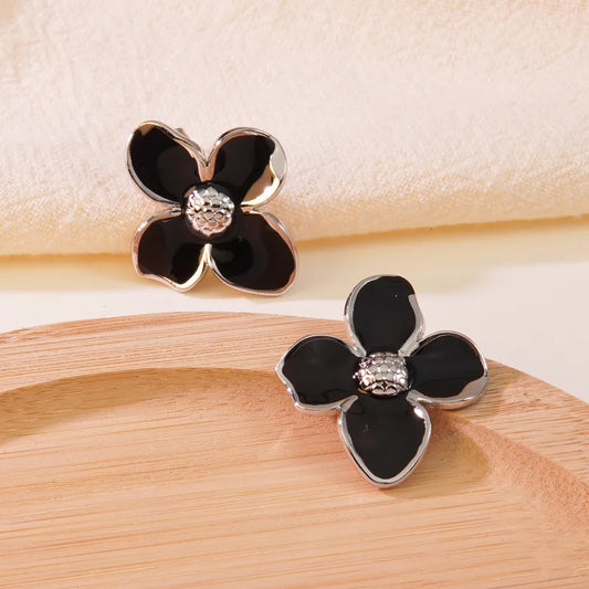 Aretes flor negra plateado