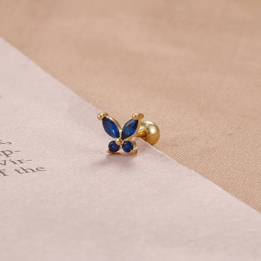 ARETES ORTOPEDICOS DE MARIPOSA CON ZIRCONES AZUL DORADO