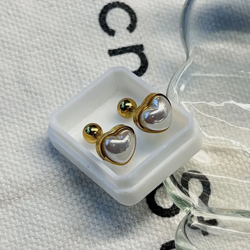 ARETES ORTOPEDICOS DE CORAZON CON PERLA DORADO